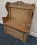 A PINE HALL SETTLE, with a hinged seat Dimensions:width 87cm x depth 43cm x height 112cm Condition