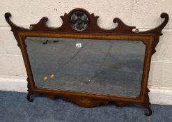 AN EARLY 20TH CENTURY BEVELLED EDGE WALL MIRROR, with a central crest to the top and shell inlay