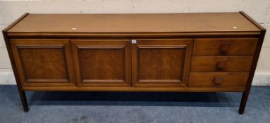A MID-CENTURY TEAK SIDEBOARD, fitted with a fall front door, double cupboard doors and three drawers
