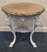 CASKELL'S OF BIRMINGHAM, A WHITE PAINTED CAST IRON PUB TABLE, with masks, scrolled and foliate