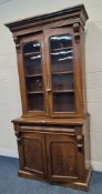A VICTORIAN MAHOGANY BOOKCASE, the double glass doors enclosing three adjustable shelves, atop a