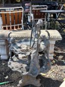 A WEATHERED PART LEAD TWO TIER WATER FOUNTAIN, depicting four cherubs over two shell-shaped tiers,