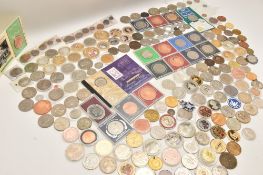 A plastic box containing loose Crown-size coins and medallions, all high grade, over 100 coins,