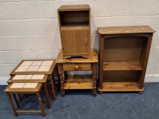 A MODERN PINE OPEN BOOKCASE, a pine side table with a single drawer, an oak bedside cupboard,