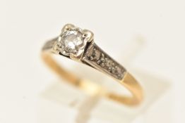 A YELLOW METAL SINGLE STONE DIAMOND RING, round brilliant cut diamond claw set in a rub over white
