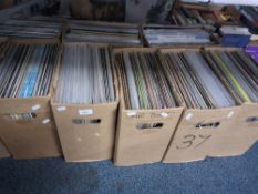 NINE BOXES OF VINYL ALBUMS from artists such as Jim Croce, The Three Degrees, Brook Benton, Waylon