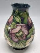 A MOORCROFT POTTERY 'LENTEN ROSE' LIMITED EDITION VASE, designed by Emma Bossons, tube lined with