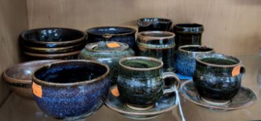 A GROUP OF WINCHCOMBE STUDIO POTTERY, two teacups and saucers, three mugs, covered sugar bowl, six