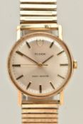 A VINTAGE TUDOR 9CT GOLD WRISTWATCH. The silver tone dial with hourly applied makers, the dial is