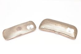 TWO EARLY 20TH CENTURY SILVER AND WHITE METAL GLASS CASES. Each wih engine turned detail. One
