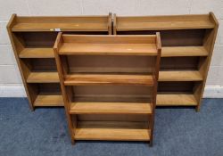 THREE SMALL OPEN BOOKCASES, each with four shelves Dimensions:larger bookcase width 80cm x depth