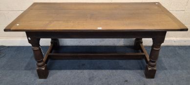 A GOOD QUALITY REPRODUCTION OAK REFECTORY TABLE, raised on block and turned legs, united by