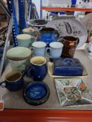 A GROUP OF MIXED DENBY CERAMICS comprising cups, saucers, jugs, pin trays, butter dish, oval