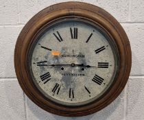 AN OAK-CASED WALL CLOCK, the glass door enclosing a 12-inch dial, depicting Roman numerals, signed
