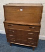 A MID-CENTURY TEAK BUREAU, the fall front door enclosing a fitted interior, over four drawers,