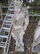 A WEATHERED CONCRETE FEMALE GARDEN STATUE, height 140cm Condition Report:appears in good
