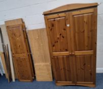 A MODERN PINE AND PINE EFFECT DOUBLE DOUBLE DOOR WARDROBE, along with a dismantled triple door