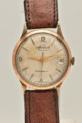 A VINTAGE 9CT GOLD ACCURIST WRISTWATCH. The silver tone dial with gilt hourly applied markers and