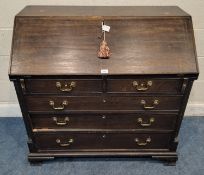A GEORGIAN OAK BUREAU, the fall front door enclosing a fitted interior, above two short over three