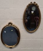A GILT RESIN OVAL BEVELLED EDGE WALL MIRROR, along with another mirror Dimensions:resin mirror width