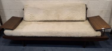 TOOTHILL, A MID-CENTURY AFROMOSIA TEAK SOFA, with a fold-over backrest, flanked by two height-