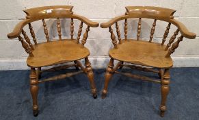 STEWART LINFORD, A PAIR OF BOW TOP SMOKERS / CAPTAINS CHAIRS, with outswept armrests, an elm