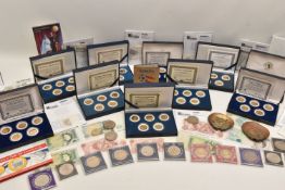 large box of coins with some kiloware, a few GB notes and a set of boxed USA statehood quarters.