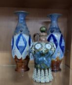 A GROUP OF THREE ROYAL DOULTON LAMBETH STONEWARE POTTERY, comprising a pair of Art Nouveau design