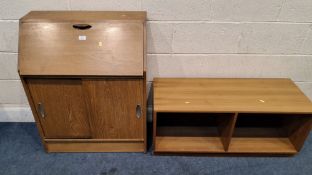 A MID-CENTURY TEAK BUREAU, the fall front door enclosing a fitted interior, over double sliding