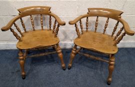 STEWARD LINFORD, A PAIR OF BOW TOP SMOKERS / CAPTAINS CHAIRS, with outswept armrests, an elm