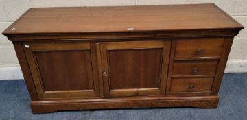 A MODERN HARDWOOD SIDEBOARD, fitted with double cupboard doors and three drawers Dimensions:width