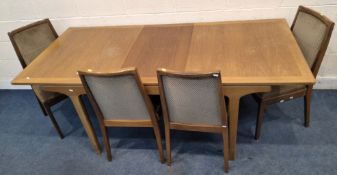 A NATHAN MID-CENTURY TEAK EXTENDING DINING TABLE, with a single fold-out leaf, raised on tapered