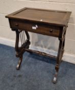 AN EARLY 20TH CENTURY SIDE TABLE, raised on Lyre-shaped supports and scrolled legs, united by a