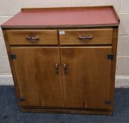 A 20TH CENTURY OAK DOUBLE DOOR CABINET, with a Formica top, two drawers and double cupboard doors