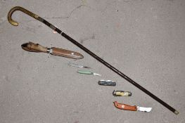 An Edwardian bamboo sword stick, the curved handle covered in snakeskin, hallmarked silver mount,
