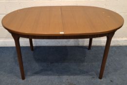 A.H. MCINTOSH & CO LTD, KIRKCALDY, SCOTLAND, A MID-CENTURY TEAK OVAL EXTENDING DINING TABLE, with