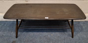 LUCIAN ERCOLANI, A MID-CENTURY DARK ELM AND BEECH RECTANGULAR COFFEE TABLE, raised on cylindrical