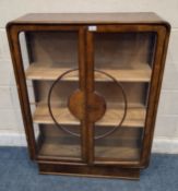 AN ART DECO WALNUT CHINA CABINET, the double glass doors enclosing two later shelves Dimensions: