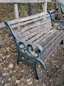 A CAST IRON GARDEN BENCH, with teak slats, length 130cm Condition Report:structurly sound,