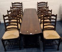 A GOOD QUALITY REPRODUCTION TITCHMARSH AND GOODWIN STYLE OAK GATE LEG WAKE TABLE, raised on block