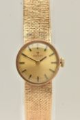 A LADIES 9CT GOLD 'TISSOT' WRISTWATCH, manual wind, round gold tone dial signed 'Tissot', baton