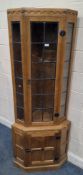 WORKSHOP OF ROBERT THOMPSON'S CRAFTSMEN LIMITED, MOUSEMAN OF KILBURN, A SOLID OAK CORNER CUPBOARD,