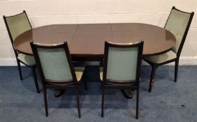 A MID-CENTURY MAHOGANY OVAL EXTENDING DINING TABLE, with a single fold-out leaf, along with a set of
