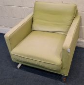 A GREEN ARMCHAIR, with metal legs Dimensions:width 79cm x depth 88cm x height 8cm Condition Report: