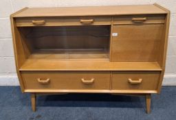 G PLAN EGOMME, A MID CENTURY OAK SIDEBOARD, fitted with three assorted drawers, a fall front door