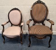 A 19TH CENTURY WALNUT ARMCHAIR, with multi-coloured striped upholstery, raised on cabriole front