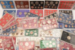 Plastic-cased coin sets mostly QEII x46 and 5 carded coin sets, QEII sets consist of full-reign