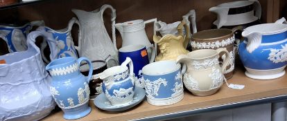 A GROUP OF MOSTLY 19TH - CENTURY MOULDED JUGS, comprising a collection of jugs various shapes and
