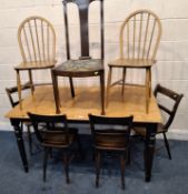 A MODERN PARTIALLY PAINTED TABLE, raised on turned legs, a set of four elm chairs, a pair of Ercol