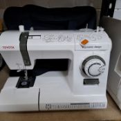A TOYOTA C.E.V. (CREATIVE ELEGANCE VOGUE) SEWING MACHINE, model ergonomic design, with extension